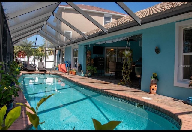 view of pool featuring a lanai and a patio