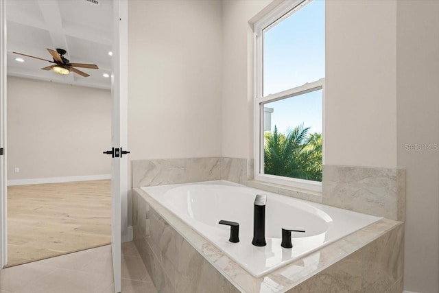 bathroom featuring a garden tub, tile patterned flooring, baseboards, and recessed lighting