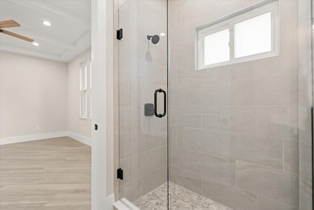 full bathroom with wood finished floors, recessed lighting, a shower stall, and baseboards