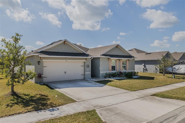 view of front facade featuring a garage and a front lawn