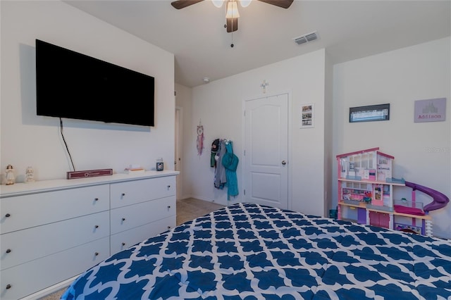 bedroom with light carpet, ceiling fan, and visible vents