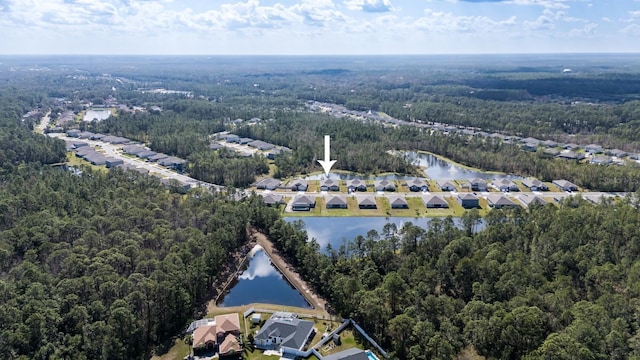 aerial view featuring a water view, a residential view, and a view of trees