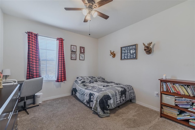 bedroom with light carpet, baseboards, and a ceiling fan