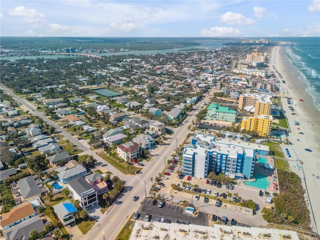 bird's eye view with a water view and a view of the beach