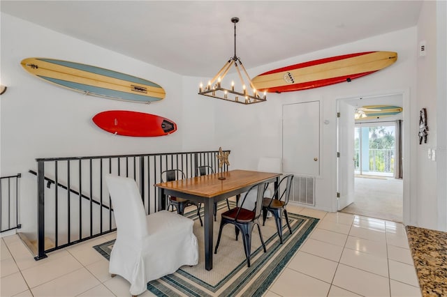 dining area with an inviting chandelier and light tile patterned floors