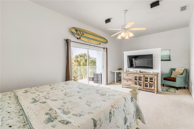 carpeted bedroom featuring ceiling fan and access to exterior