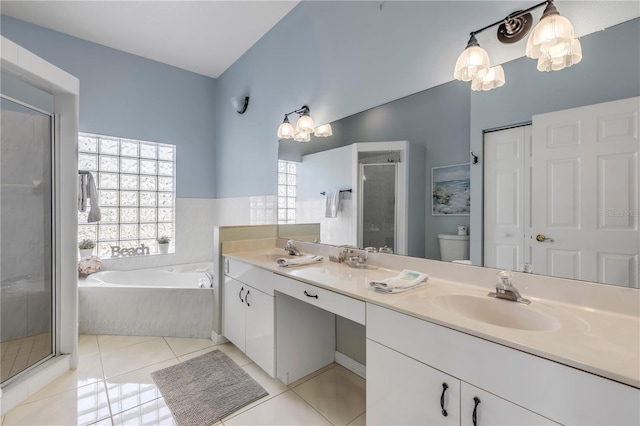 full bathroom with tile patterned floors, toilet, separate shower and tub, and vanity
