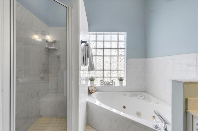 bathroom featuring separate shower and tub and a healthy amount of sunlight