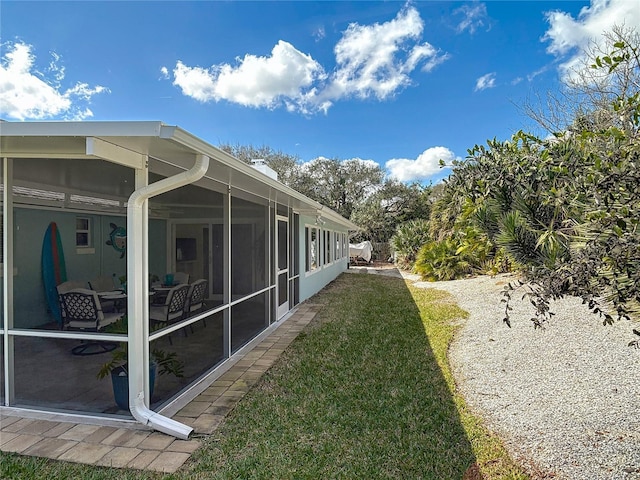 view of yard with a sunroom