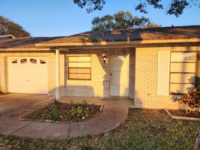 ranch-style house featuring a garage