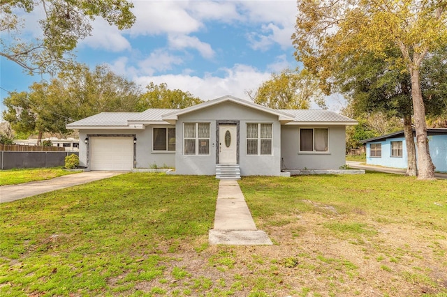 ranch-style house featuring a garage and a front lawn