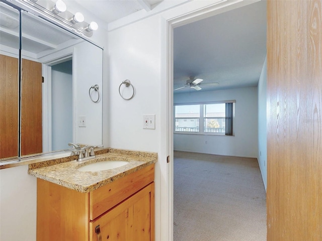 bathroom with ceiling fan and vanity