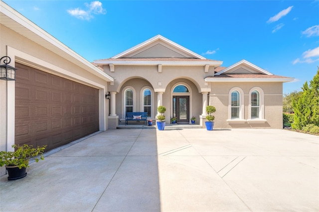 rear view of house with a garage