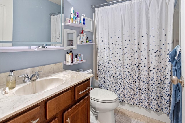 bathroom featuring vanity, shower / bath combo with shower curtain, tile patterned flooring, and toilet