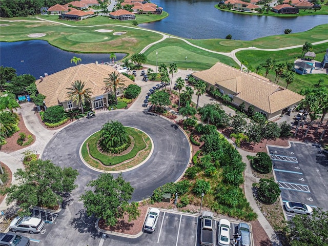 bird's eye view with a water view, a residential view, and golf course view