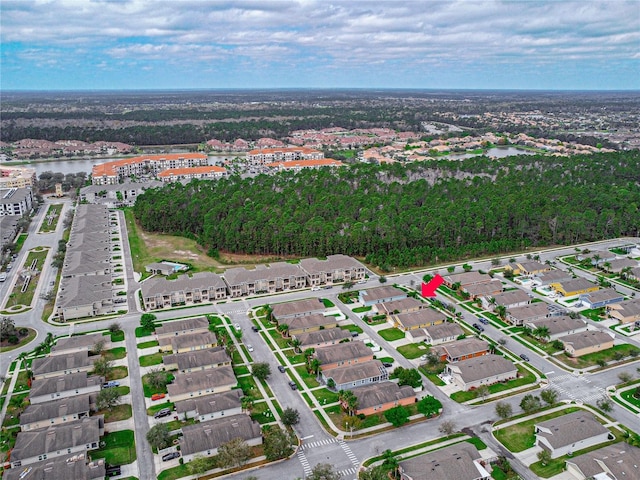 birds eye view of property with a water view and a residential view