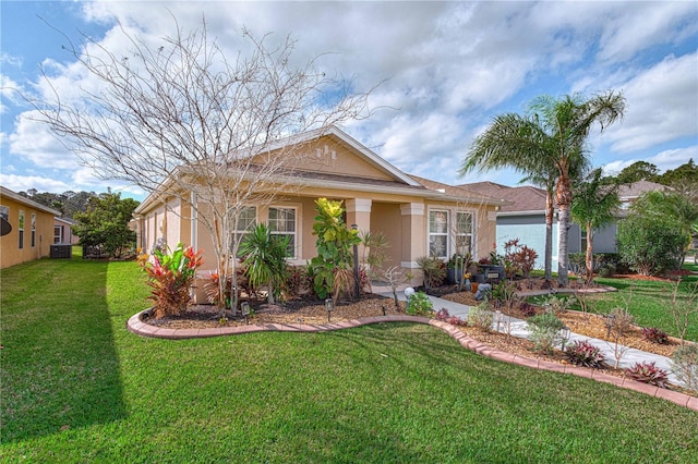 3368 Tuscano Ave NE, New Smyrna Beach, FL 32168 - ranch-style house featuring a front yard, stucco siding, and cooling unit