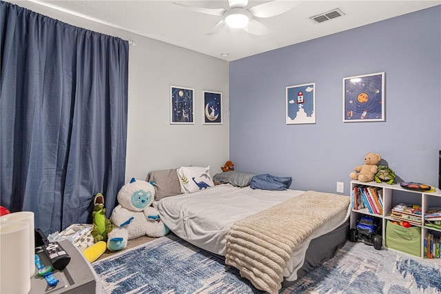 bedroom with a ceiling fan and visible vents