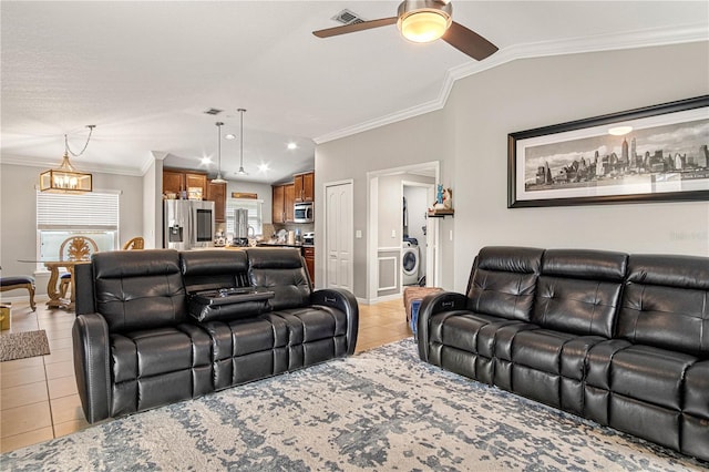 living area featuring lofted ceiling, light tile patterned floors, visible vents, and crown molding