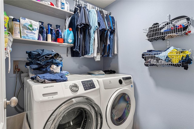 laundry room with laundry area and washing machine and clothes dryer