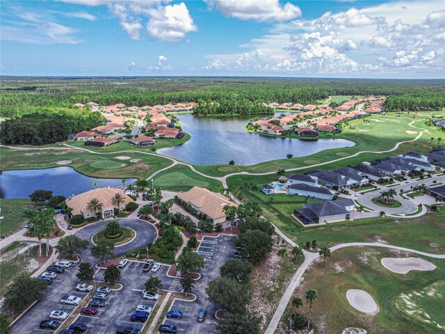 3368 Tuscano Ave NE, New Smyrna Beach, FL 32168 - aerial view of property's location with a nearby body of water, a golf club, a heavily wooded area, and nearby suburban area