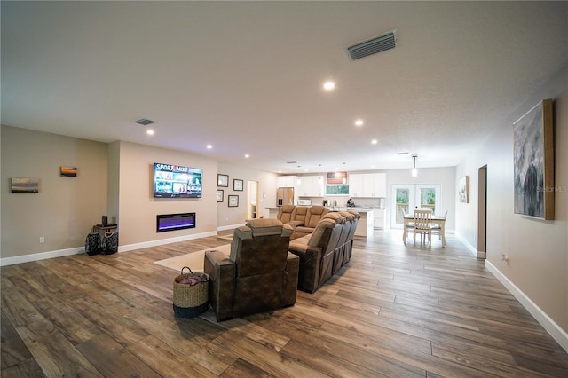 living room with hardwood / wood-style flooring