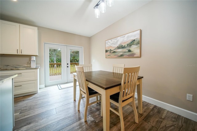 dining area with french doors and dark wood-type flooring