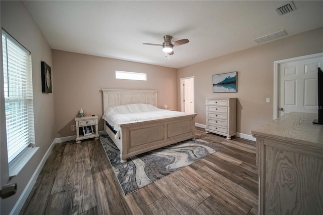 bedroom with ceiling fan and dark hardwood / wood-style flooring