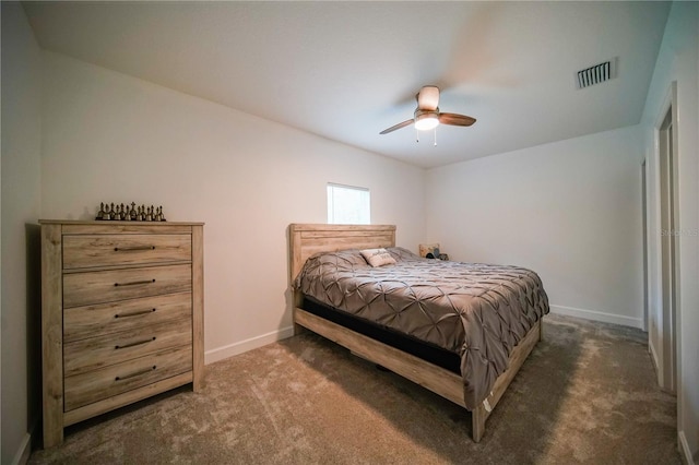 bedroom featuring dark colored carpet and ceiling fan