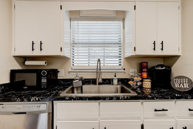 kitchen with stainless steel dishwasher, sink, and white cabinets