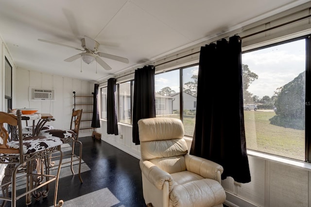 dining space with ceiling fan and a wall unit AC