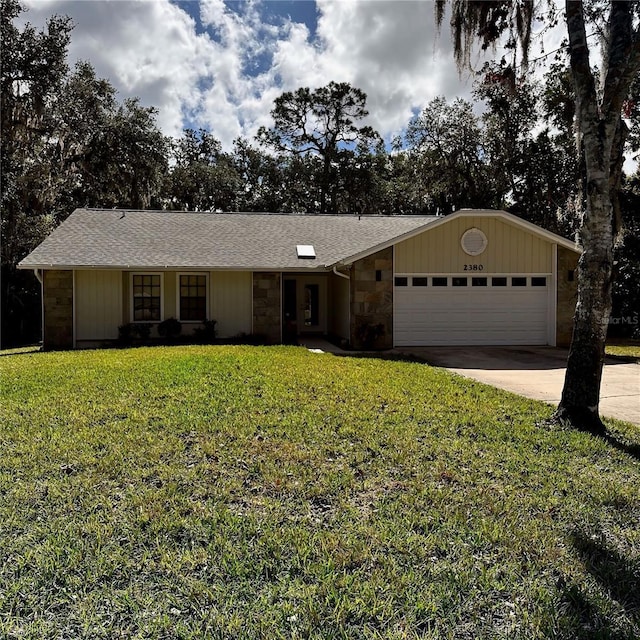 ranch-style house with a garage and a front yard