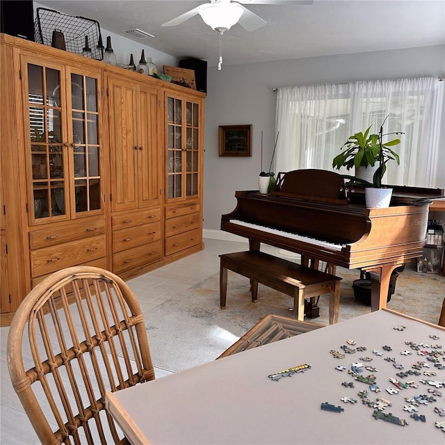 living area featuring ceiling fan