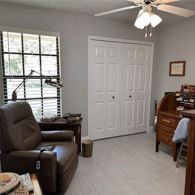 interior space featuring ceiling fan