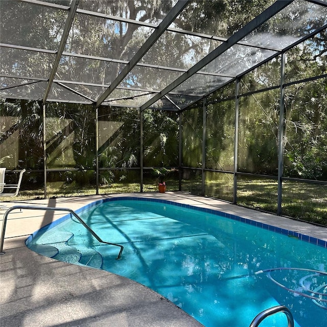 view of pool featuring a lanai