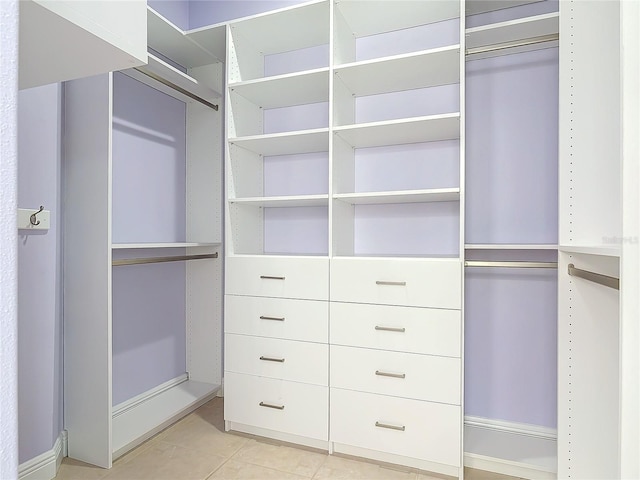walk in closet featuring light tile patterned floors
