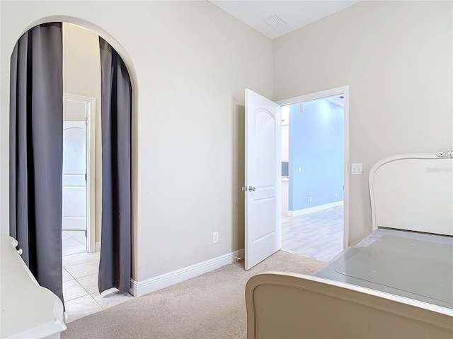 bedroom with light colored carpet