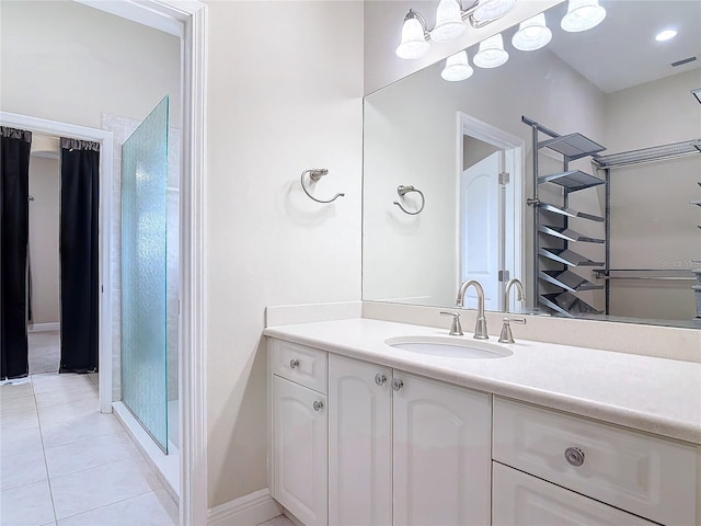 bathroom with tile patterned flooring and vanity