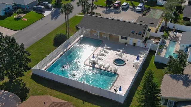 26 Birdie Dr, New Smyrna Beach, FL 32168 - community pool featuring a patio area, a fenced backyard, and a community hot tub