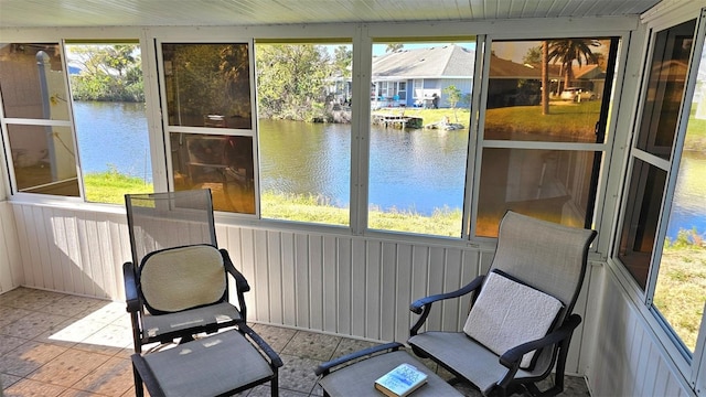 26 Birdie Dr, New Smyrna Beach, FL 32168 - sunroom with a wealth of natural light and a water view