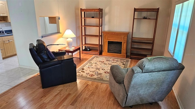 26 Birdie Dr, New Smyrna Beach, FL 32168 - living area featuring light wood finished floors and baseboards