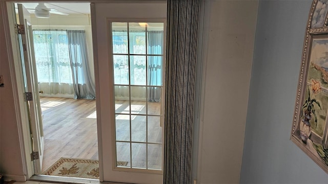 26 Birdie Dr, New Smyrna Beach, FL 32168 - doorway to outside with ceiling fan and wood finished floors