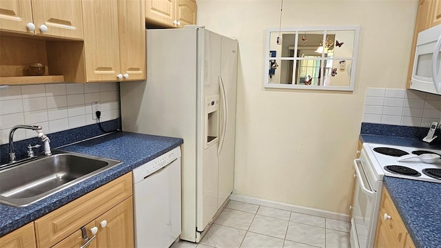 26 Birdie Dr, New Smyrna Beach, FL 32168 - kitchen featuring white appliances, tasteful backsplash, light tile patterned floors, dark countertops, and a sink