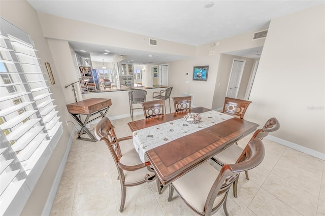 dining area with light tile patterned flooring