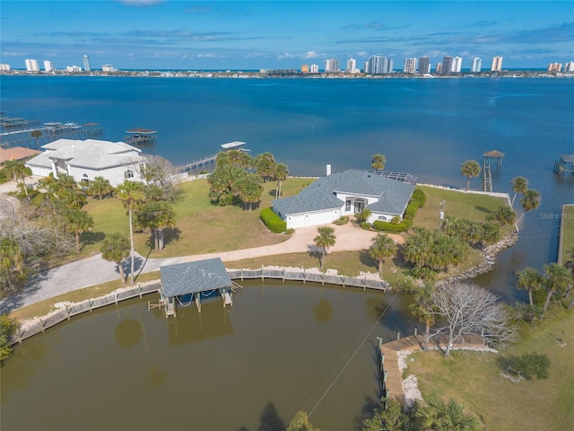 drone / aerial view with a water view and a city view