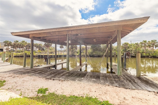 view of dock featuring a water view and boat lift