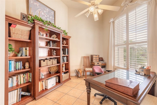 office space with light tile patterned floors and a ceiling fan