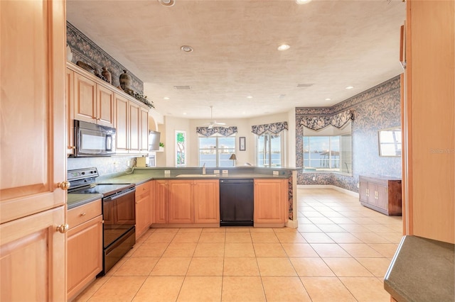 kitchen with pendant lighting, light tile patterned floors, a sink, a peninsula, and black appliances