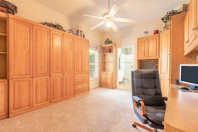 office area featuring light carpet and a ceiling fan