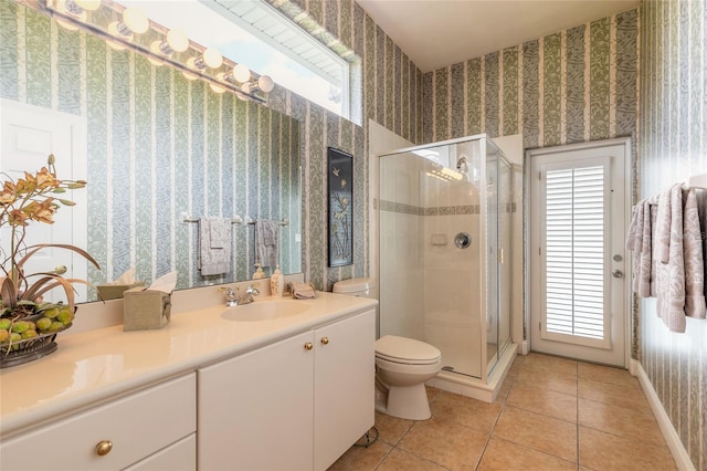 full bathroom with toilet, wallpapered walls, a healthy amount of sunlight, and tile patterned floors